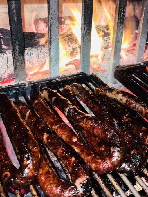 Grilled Figatelli in the Fireplace in Corsican Mountains